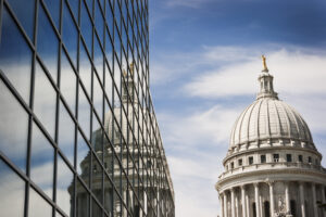 State Capitol Dome Reflecting in Steel and Glass Building